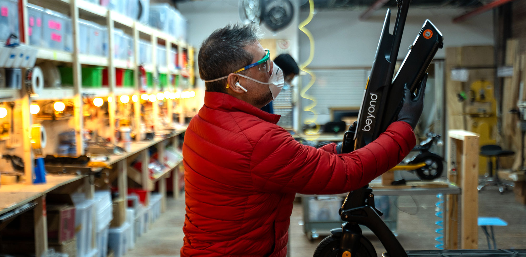 Beyond mechanic performing scooter maintenance